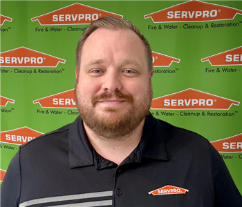 man in front of backdrop