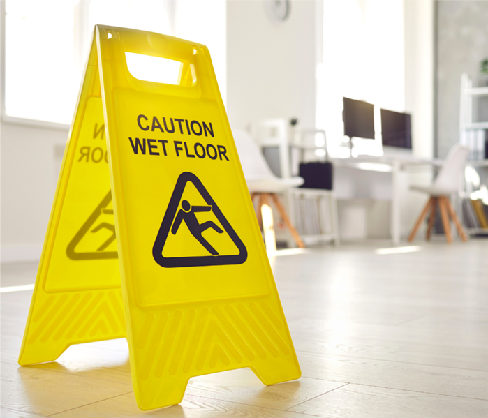 yellow 'caution wet floor' sign